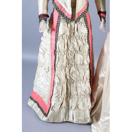 257 - A good tailored cream silk bodice and skirt with almost imperceptible stripes, c 1880’s, the bodice ... 