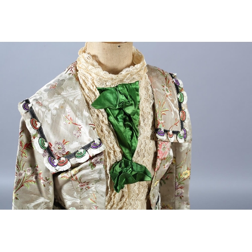 258 - Two most unusual silk bodices, the first in a very soft patterned silk trimmed with ruby velvet and ... 