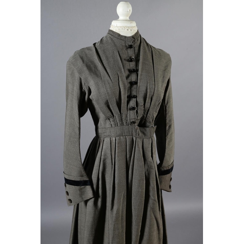 267 - A simple mid-19th century grey wool dress with fitted bodice, gathered skirt, the bodice lined in cr... 