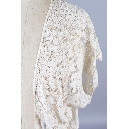 270 - Antique Lace: a handmade lace jacket, hip length, shaped, Milanese bobbin lace, seemingly constructe... 