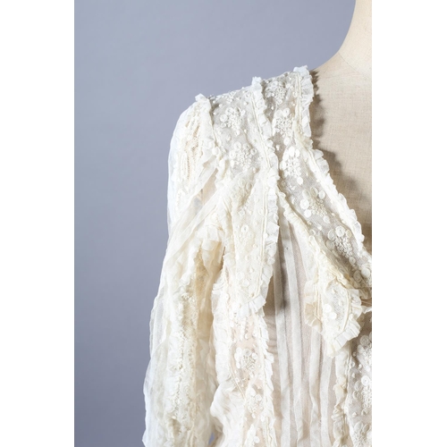 271 - A very ornate Edwardian cream net and chemical lace blouse, with full sleeves, shoulder panels and t... 