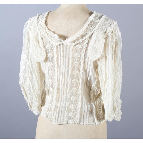 271 - A very ornate Edwardian cream net and chemical lace blouse, with full sleeves, shoulder panels and t... 