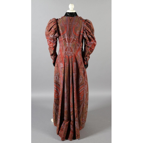 273 - A mid-19th century coat, made from a good woven paisley shawl, gigot sleeves, the collar, inside bod... 