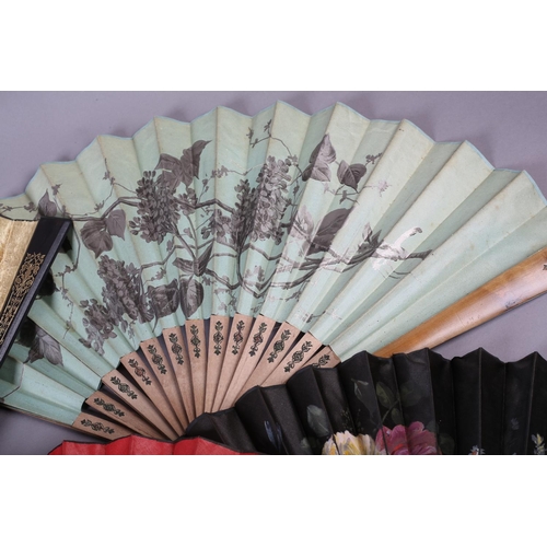 28 - Four large late 19th century fans, all with wood montures, three with a fabric leaf, one of paper, a... 