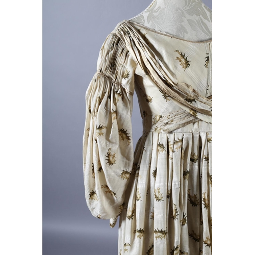 281 - c.1835, a fine cream wool gown with gigot sleeves and the latest narrow longitudinal pleats at the s... 