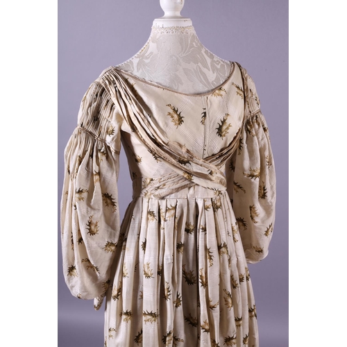 281 - c.1835, a fine cream wool gown with gigot sleeves and the latest narrow longitudinal pleats at the s... 