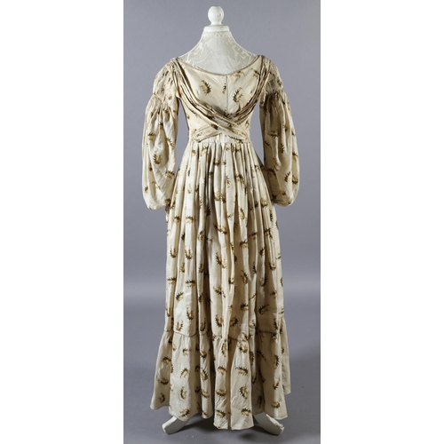 281 - c.1835, a fine cream wool gown with gigot sleeves and the latest narrow longitudinal pleats at the s... 