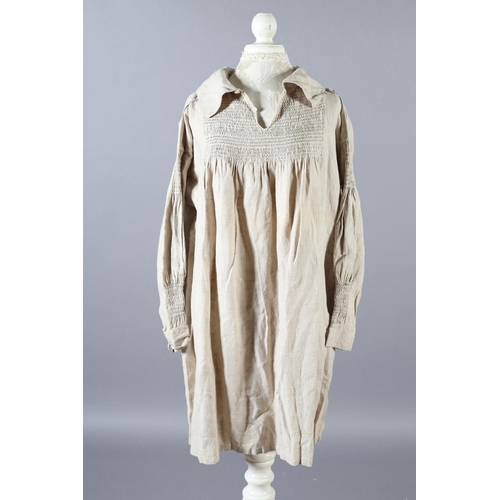 284 - Two mid-19th century farmers smocks, the first a good example, very large and long, smocking both si... 