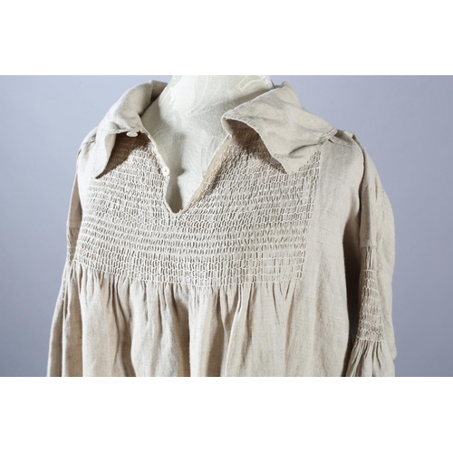 284 - Two mid-19th century farmers smocks, the first a good example, very large and long, smocking both si... 