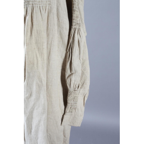 284 - Two mid-19th century farmers smocks, the first a good example, very large and long, smocking both si... 