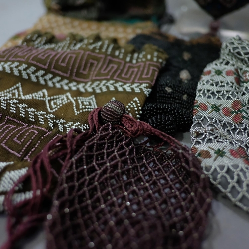 318 - 1920’s beaded bags, a selection of eight examples, six with draw string fastening, the remaining two... 