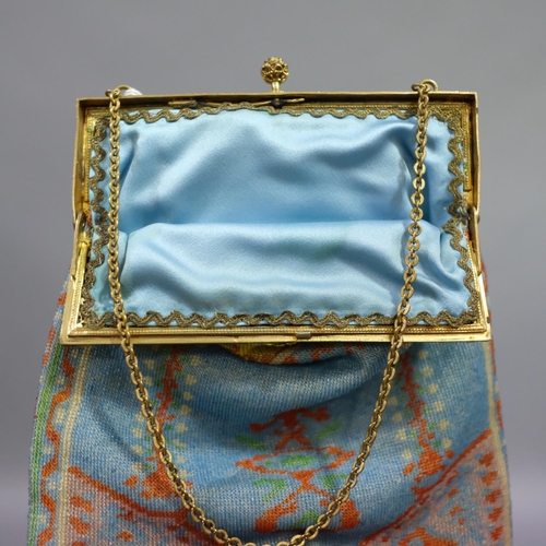 323 - A good woven beaded evening bag, circa 1900, the metal frame enamelled in black, white and turquoise... 