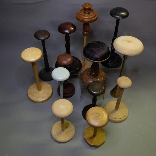 334 - 1920’s and earlier hat stands, with one heavy wood example covered on the upper section with embosse... 