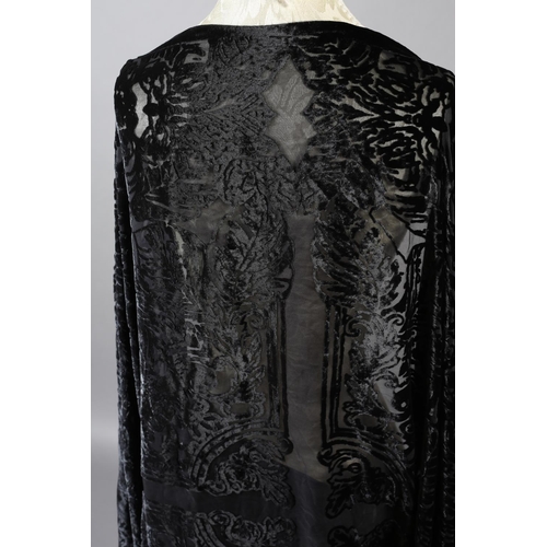 355 - Two 20th century black cut velvet garments, one a draped top, hip-length, the other a fringed shawl,... 