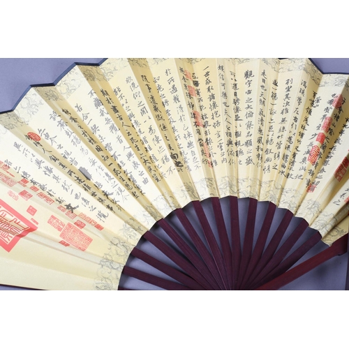 46 - Two large, good quality, folding fans, both printed on silk, on wood montures, one showing buildings... 