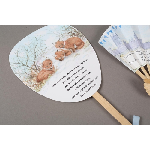 49 - Judith Elliott: a fixed fan depicting three little foxes, with a poem, signed and dated 1998; a fan ... 