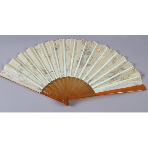 54 - A c.1890’s gauze fan painted with butterflies, signed “Antoinette”, the leaf mounted on blonde torto... 