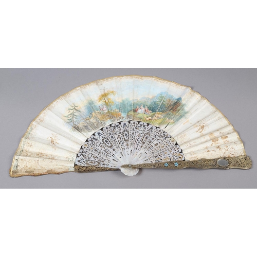 56B - An ornate mid-19th century mother of pearl fan, the guards entirely of carved and pierced gilt metal... 