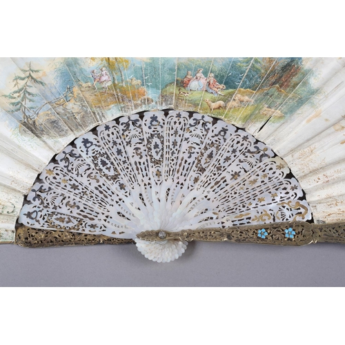 56B - An ornate mid-19th century mother of pearl fan, the guards entirely of carved and pierced gilt metal... 