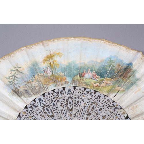 56B - An ornate mid-19th century mother of pearl fan, the guards entirely of carved and pierced gilt metal... 