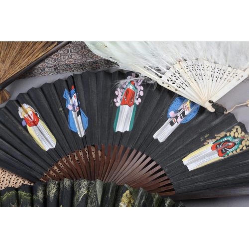 59 - The Peking Opera: Eight 20th century Chinese fans, five of which are contained in brocade covered bo... 