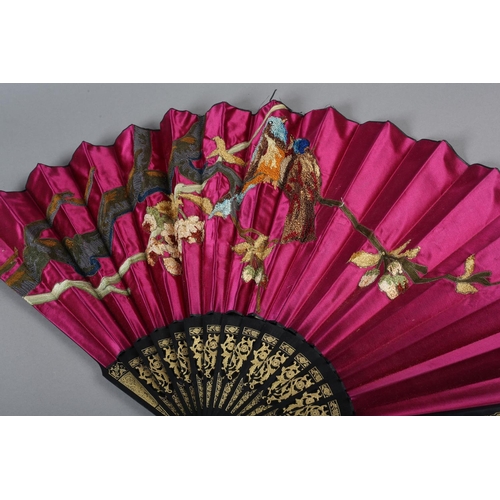 62 - Three late 19th century fans, all with wood montures, with decorative gilding, the cerise silk leaf,... 