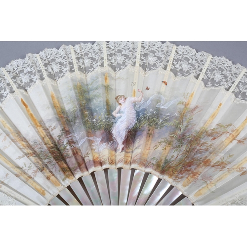 79 - c.1890’s, a large and showy painted silk fan, the cream silk edged in cream machine lace, the centra... 