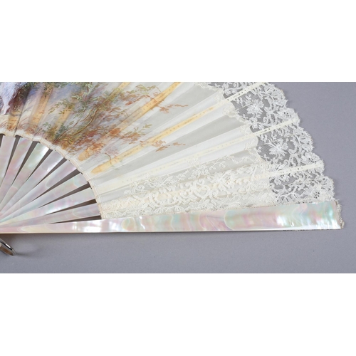 79 - c.1890’s, a large and showy painted silk fan, the cream silk edged in cream machine lace, the centra... 