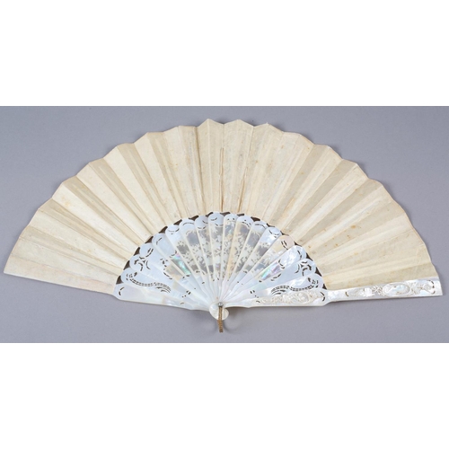 84 - A c.1880’s mother of pearl fan with very elaborate carving, the guards pierced then applied with por... 