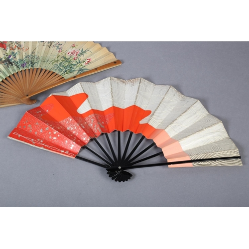 128 - Two Japanese fans, the first with wood monture, the guards inset with shibayama insects, three diffe... 