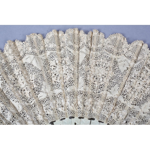 151 - A Maltese lace fan worked in silk in three horizontal panels, quite a detailed design with seven rou... 