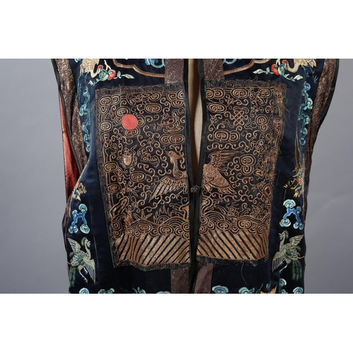 194 - A 19th century long Chinese silk woman’s sleeveless vest, or tabard, Xiapei , Qing Dynasty, bearing ... 