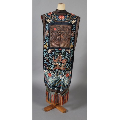 194 - A 19th century long Chinese silk woman’s sleeveless vest, or tabard, Xiapei , Qing Dynasty, bearing ... 