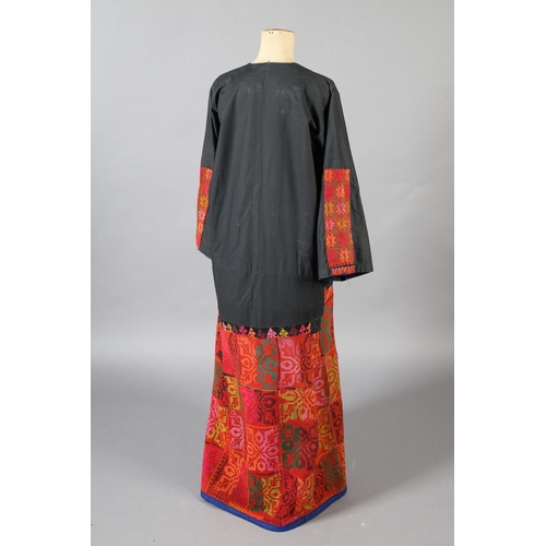 197 - A middle eastern robe in black with panels of vibrant embroidery