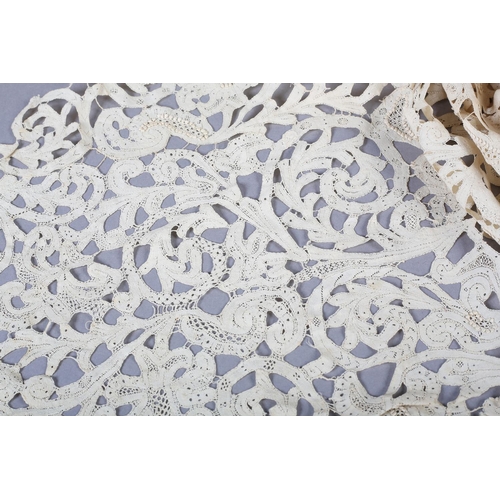 217 - Early Lace: An unusual 18th century triangular shawl, of Milanese lace with additional work in relie... 