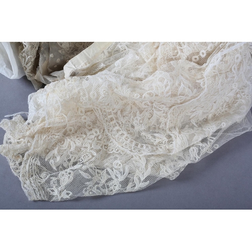 228 - Antique lace: a trained skirt panel in Limerick lace, constructed to cross over, with shaped sides; ... 