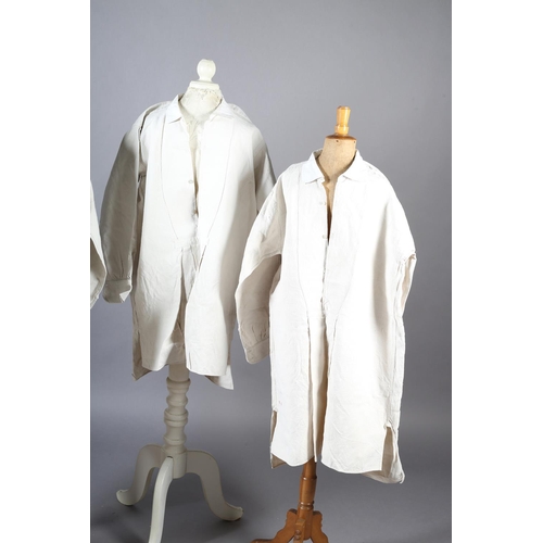 252 - Four French heavy linen gentlemen’s shirts, very long, 19th century, all with long sleeves, cotton c... 