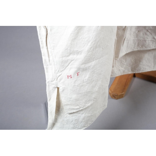 252 - Four French heavy linen gentlemen’s shirts, very long, 19th century, all with long sleeves, cotton c... 