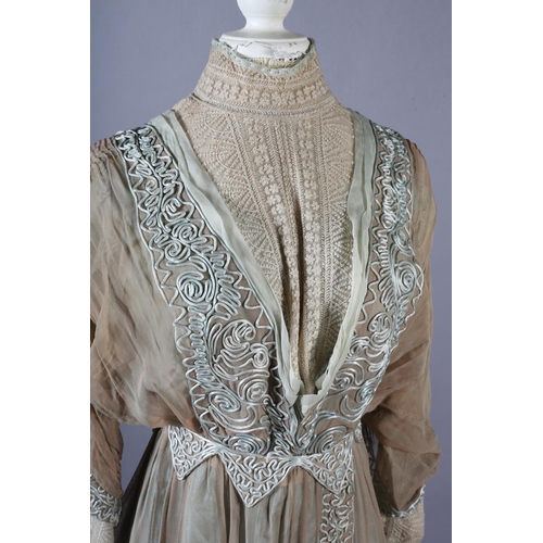 261 - An Edwardian day dress, light coffee gauze lined with sea-green silk, the dress trimmed with sea-gre... 