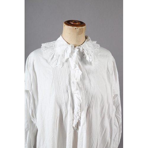 264 - A Victorian cotton nightgown with collar, long sleeves, front frill and tucks, with label at the nec... 