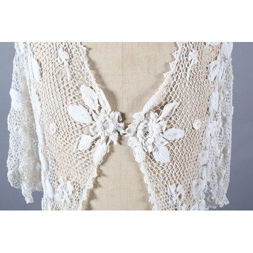 268 - Irish Crochet short sleeved, long jacket, Edwardian, designed mainly with meandering leaves interspe... 