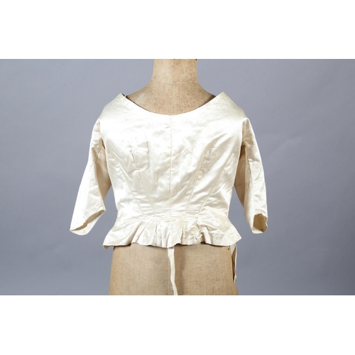 272 - A two-piece cream silk satin ensemble, comprising skirt and bodice, both lined in a pale salmon cott... 