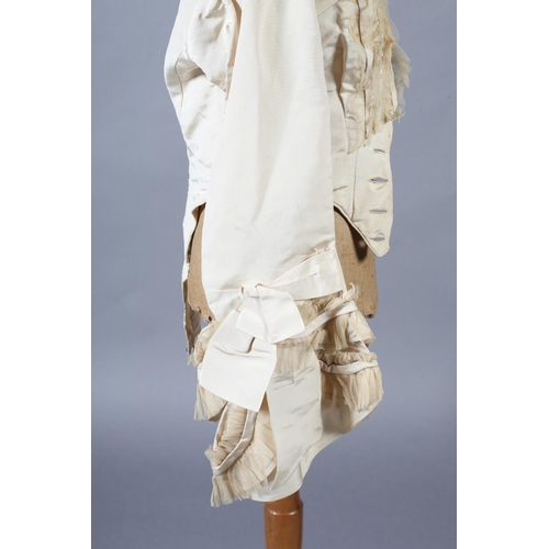 272 - A two-piece cream silk satin ensemble, comprising skirt and bodice, both lined in a pale salmon cott... 