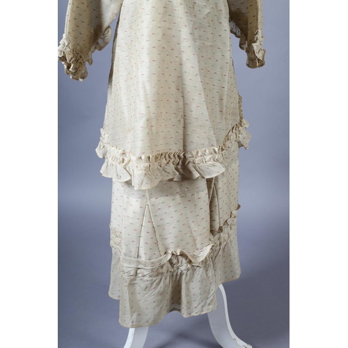 287 - A 19th century ensemble for a young girl, comprising a short-sleeved dress with matching overdress, ... 