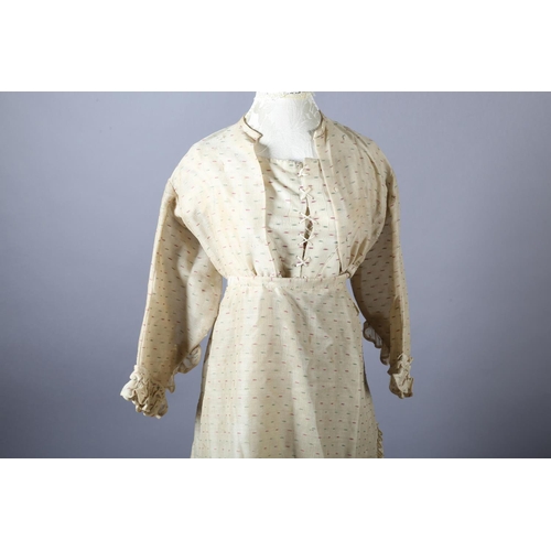 287 - A 19th century ensemble for a young girl, comprising a short-sleeved dress with matching overdress, ... 