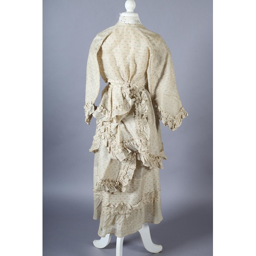 287 - A 19th century ensemble for a young girl, comprising a short-sleeved dress with matching overdress, ... 