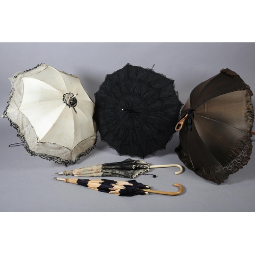 293 - Late 19th century parasols, large, the first with simple wood shaft, decorative tassel and black lac... 