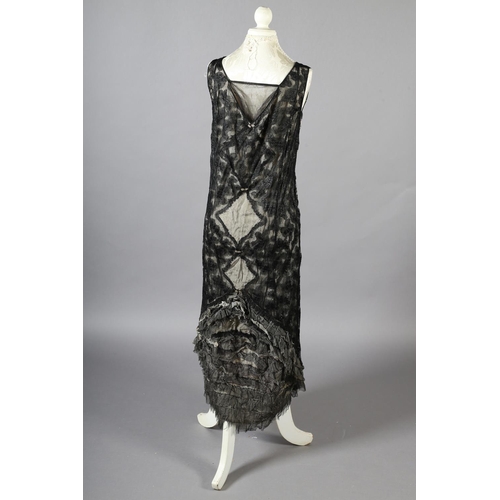 296 - A black lace 1920’s dress, full length, sleeveless, with cream silk lining, side fastening with hook... 