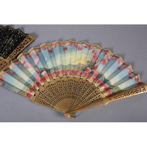 32 - A third quarter 19th century wood fan with painted silk leaf, the monture painted in gold, carved, t... 