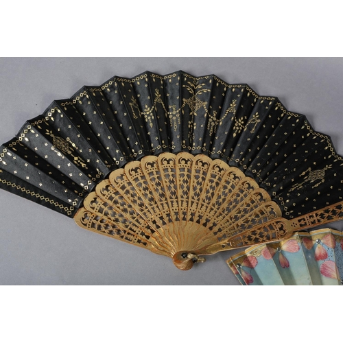 32 - A third quarter 19th century wood fan with painted silk leaf, the monture painted in gold, carved, t... 